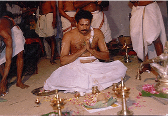 The Thanthri performing the installation of the idols